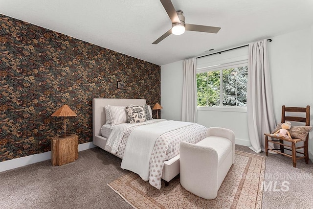 bedroom with carpet, baseboards, ceiling fan, and wallpapered walls