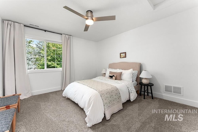 carpeted bedroom featuring baseboards and ceiling fan