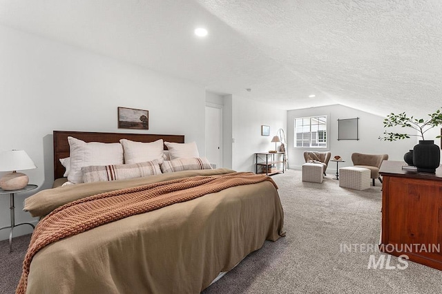 bedroom featuring light colored carpet, vaulted ceiling, a textured ceiling, and recessed lighting