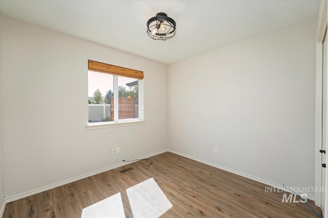 940 S Prospect Peak Way, Emmett, ID 83617 - spare room with baseboards and wood finished floors