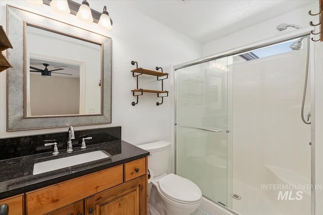 940 S Prospect Peak Way, Emmett, ID 83617 - bathroom featuring a shower stall, toilet, and vanity
