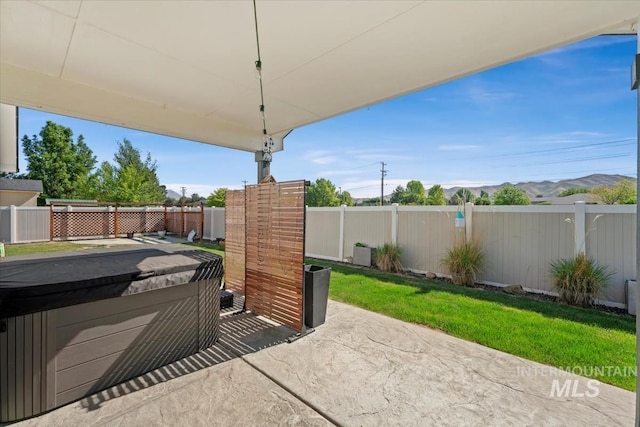 940 S Prospect Peak Way, Emmett, ID 83617 - view of patio featuring a hot tub and a mountain view