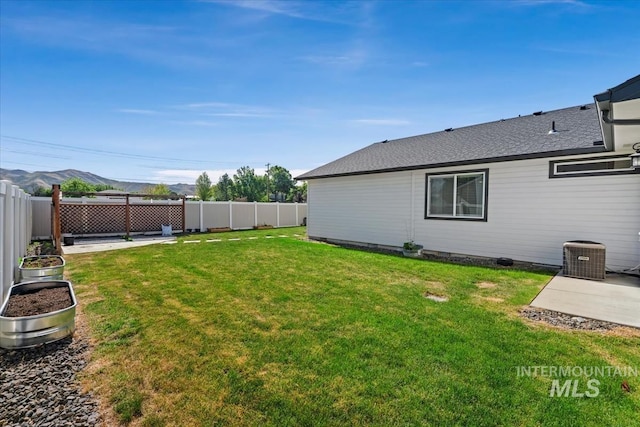940 S Prospect Peak Way, Emmett, ID 83617 - view of yard with cooling unit, a patio area, and a mountain view