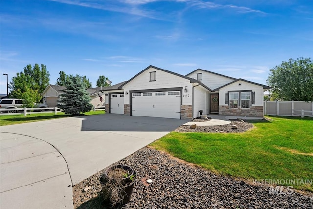 940 S Prospect Peak Way, Emmett, ID 83617 - view of front of property featuring stone siding, an attached garage, and concrete driveway