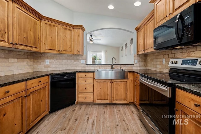 940 S Prospect Peak Way, Emmett, ID 83617 - kitchen featuring black appliances, a sink, light wood finished floors, vaulted ceiling, and brown cabinetry