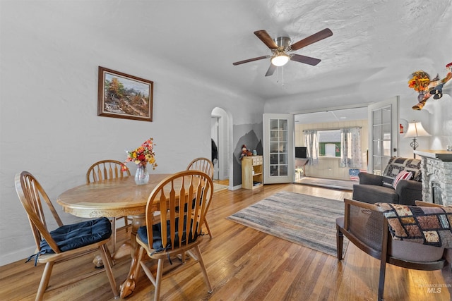 dining space featuring ceiling fan and light wood-type flooring