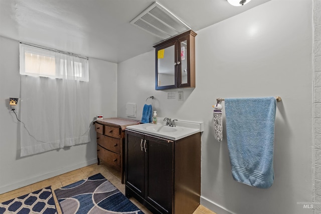 bathroom with vanity and tile patterned floors