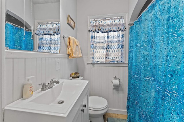 bathroom with vanity, a shower with curtain, and toilet