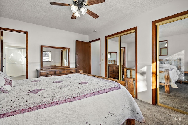 bedroom featuring ceiling fan, carpet floors, a textured ceiling, and a closet