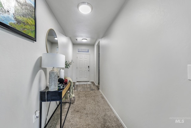 corridor with light colored carpet