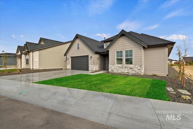 view of front of property featuring stone siding, concrete driveway, an attached garage, and a front lawn