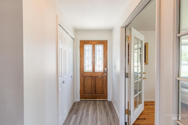 doorway to outside featuring light hardwood / wood-style flooring