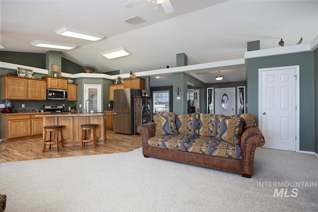 323 W 100 N, Jerome, ID 83338 - living area featuring visible vents, a ceiling fan, light carpet, and lofted ceiling