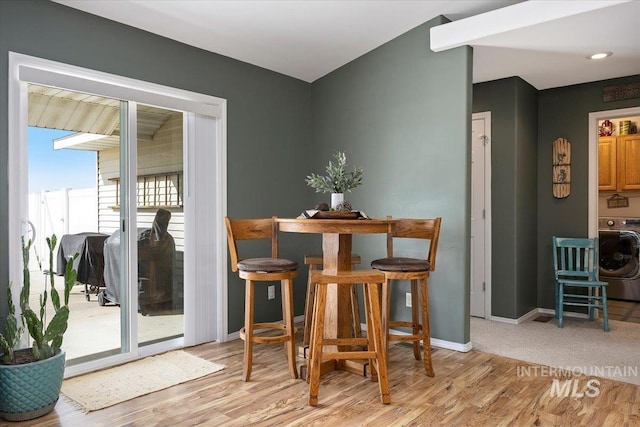 323 W 100 N, Jerome, ID 83338 - dining space with baseboards, washer / dryer, and light wood finished floors