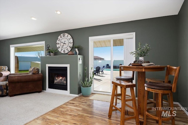 323 W 100 N, Jerome, ID 83338 - dining room with recessed lighting, baseboards, wood finished floors, and a warm lit fireplace