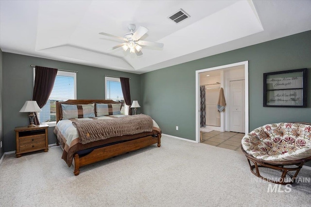 323 W 100 N, Jerome, ID 83338 - bedroom featuring a tray ceiling, a ceiling fan, visible vents, carpet flooring, and baseboards