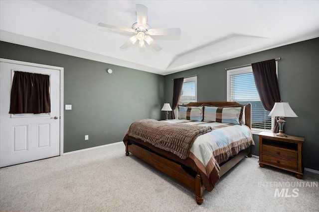 323 W 100 N, Jerome, ID 83338 - bedroom with a tray ceiling, baseboards, a ceiling fan, and carpet flooring