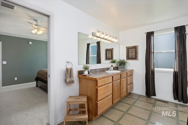 323 W 100 N, Jerome, ID 83338 - bathroom with vanity, baseboards, a ceiling fan, and visible vents