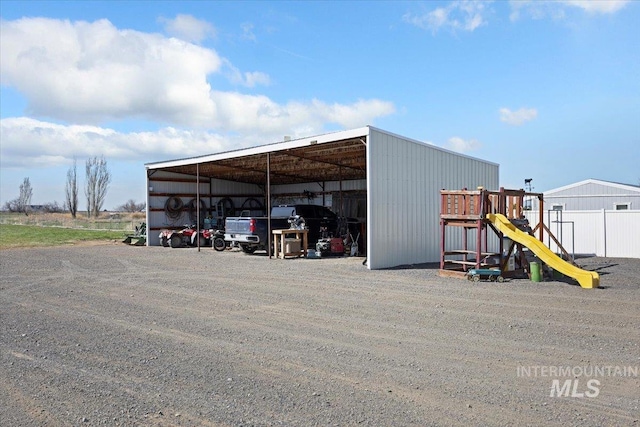 323 W 100 N, Jerome, ID 83338 - view of pole building featuring a detached carport and a playground