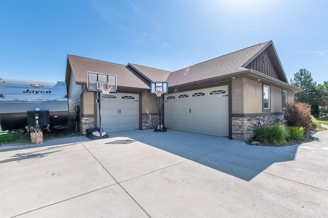 3634 E 3892 N, Kimberly, ID 83341 - view of property exterior with stone siding, an attached garage, a shingled roof, concrete driveway, and stucco siding