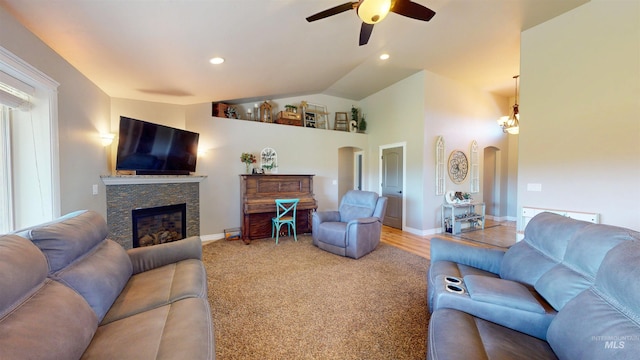 3634 E 3892 N, Kimberly, ID 83341 - living area featuring ceiling fan, a fireplace, arched walkways, vaulted ceiling, and baseboards