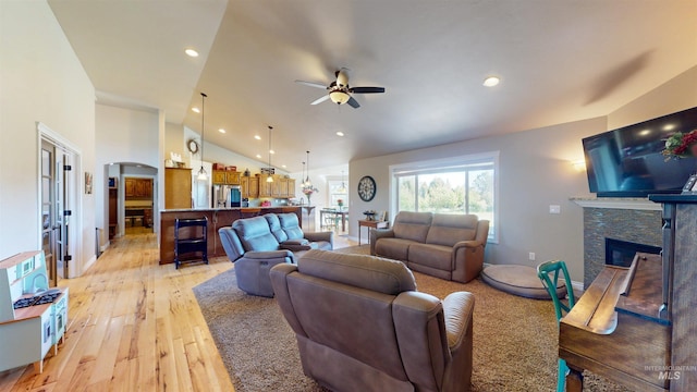 3634 E 3892 N, Kimberly, ID 83341 - living area featuring light wood finished floors, a ceiling fan, vaulted ceiling, a stone fireplace, and recessed lighting