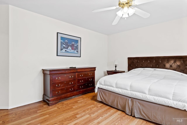 bedroom with ceiling fan and light wood-type flooring