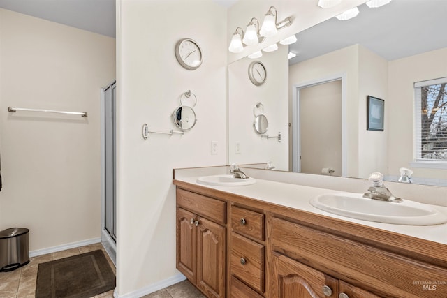 bathroom with tile patterned floors, an enclosed shower, and vanity