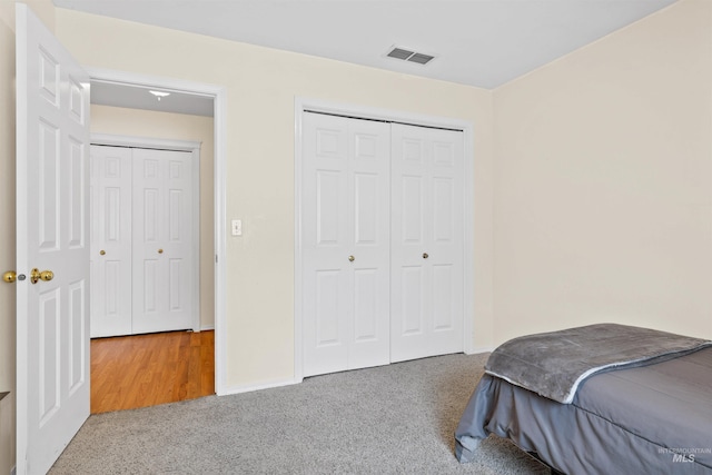 carpeted bedroom with a closet