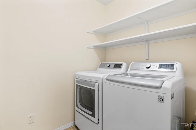 washroom with separate washer and dryer