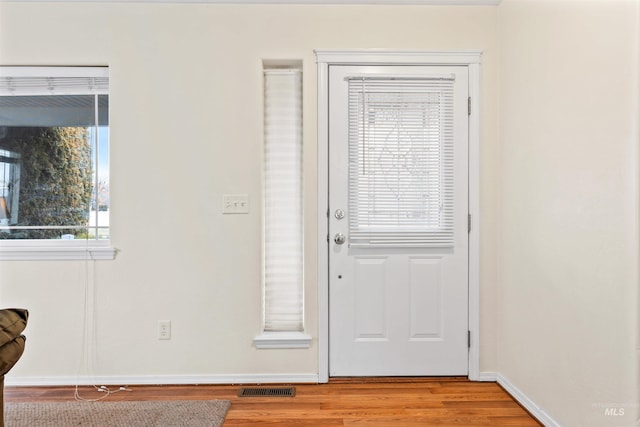 entryway with light hardwood / wood-style floors