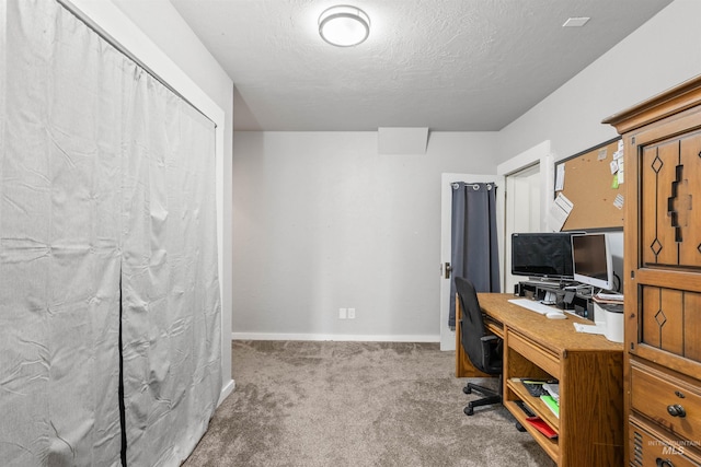 1035 Francis St, Clarkston, WA 99403 - carpeted home office featuring baseboards and a textured ceiling