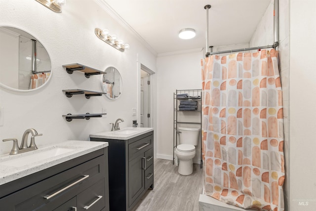 1035 Francis St, Clarkston, WA 99403 - full bathroom featuring wood finished floors, ornamental molding, two vanities, and a shower with shower curtain