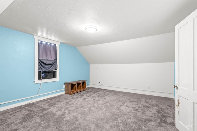 1035 Francis St, Clarkston, WA 99403 - additional living space featuring carpet floors, a textured ceiling, vaulted ceiling, and cooling unit
