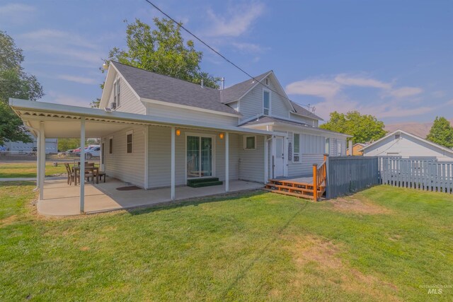 1035 Francis St, Clarkston, WA 99403 - back of property featuring a patio, a shingled roof, and a deck
