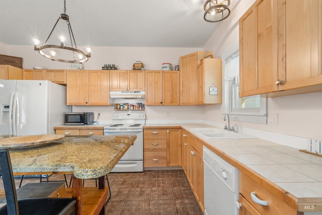1035 Francis St, Clarkston, WA 99403 - kitchen with white appliances, under cabinet range hood, a chandelier, tile countertops, and brick patterned flooring