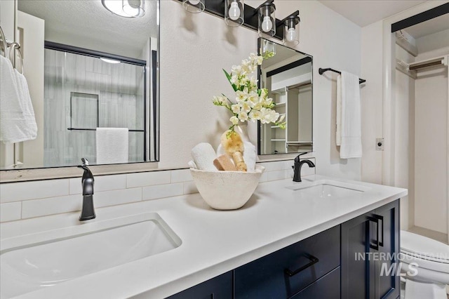1909 E Roanoke Dr, Boise, ID 83712 - bathroom with toilet, a shower with shower door, and double vanity