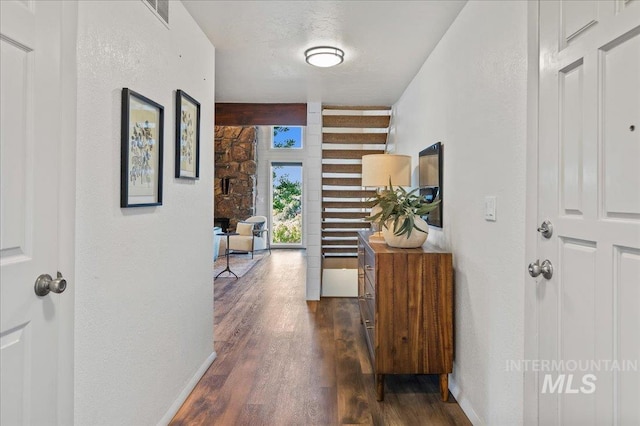 1909 E Roanoke Dr, Boise, ID 83712 - hall with dark wood finished floors and a textured wall