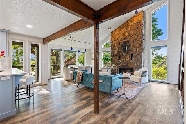 1909 E Roanoke Dr, Boise, ID 83712 - living area featuring wood finished floors, a fireplace, and a textured ceiling