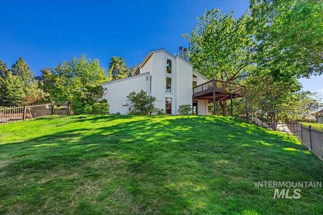 1909 E Roanoke Dr, Boise, ID 83712 - rear view of property with a deck and a chimney