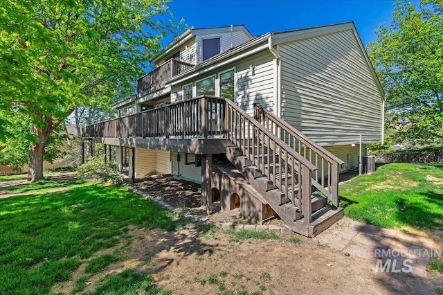 1909 E Roanoke Dr, Boise, ID 83712 - rear view of house featuring a lawn, stairway, a deck, and central air condition unit