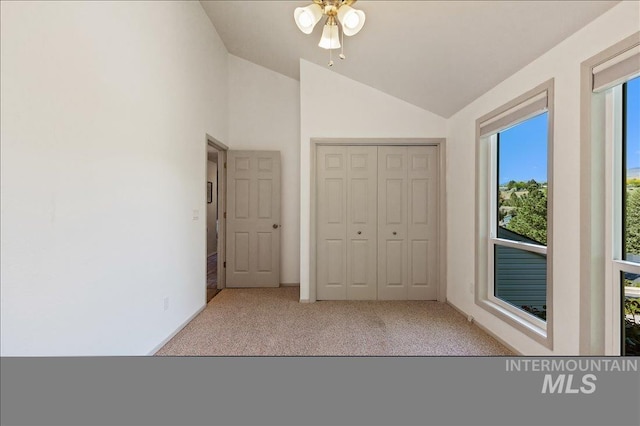 1909 E Roanoke Dr, Boise, ID 83712 - unfurnished bedroom featuring lofted ceiling, carpet, a closet, ceiling fan, and baseboards