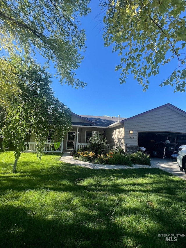 ranch-style home with a garage, covered porch, and a front yard