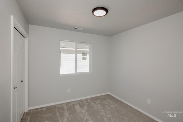 empty room with carpet floors