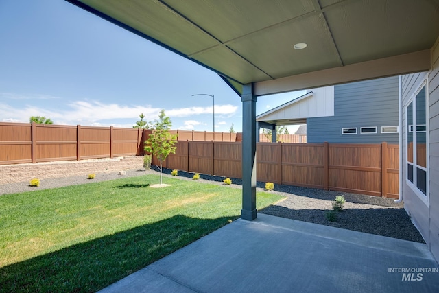 6847 W Riverwood St, Boise, ID 83709 - view of yard featuring a fenced backyard and a patio area