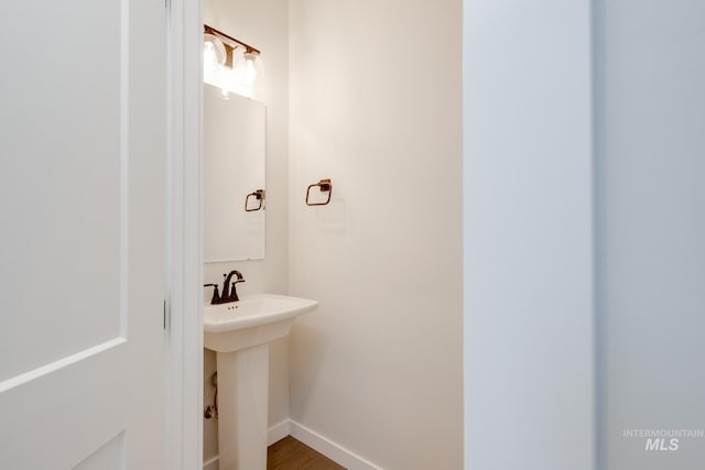 6847 W Riverwood St, Boise, ID 83709 - bathroom featuring wood finished floors and baseboards