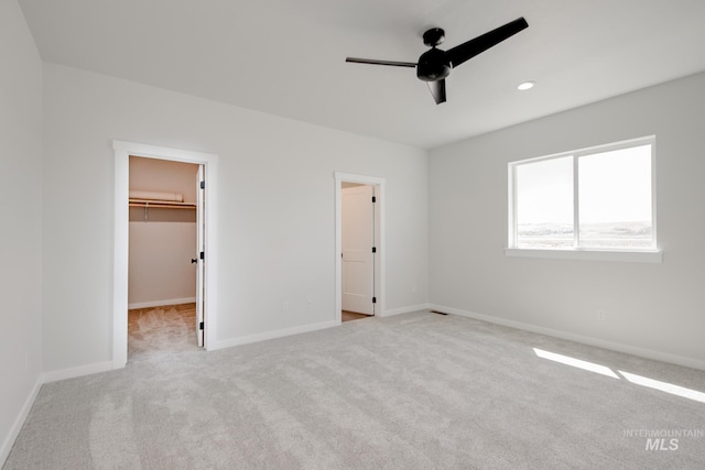 6847 W Riverwood St, Boise, ID 83709 - unfurnished bedroom with ceiling fan, baseboards, carpet flooring, and a walk in closet
