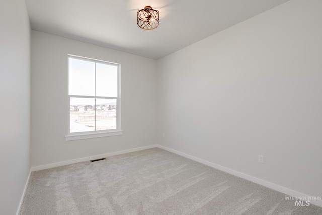 6847 W Riverwood St, Boise, ID 83709 - empty room featuring baseboards, visible vents, and carpet