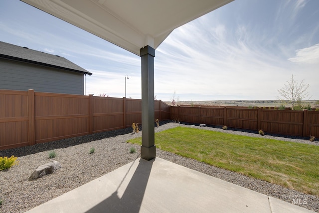 6847 W Riverwood St, Boise, ID 83709 - view of yard featuring a patio and a fenced backyard