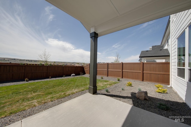 6847 W Riverwood St, Boise, ID 83709 - view of yard featuring a patio area and a fenced backyard